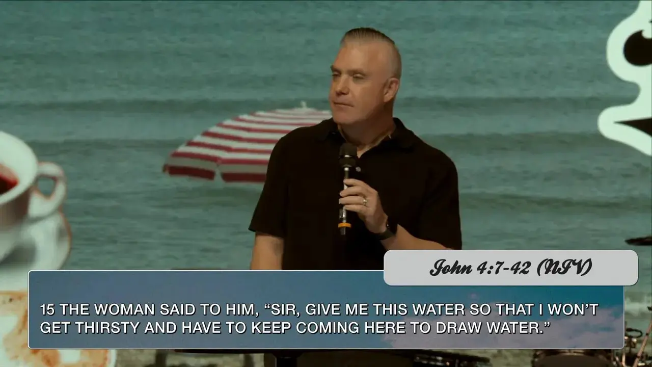 Pastor speaking on stage with 'Hear me out' backdrop and drum kit; clean shot without lower-third text.